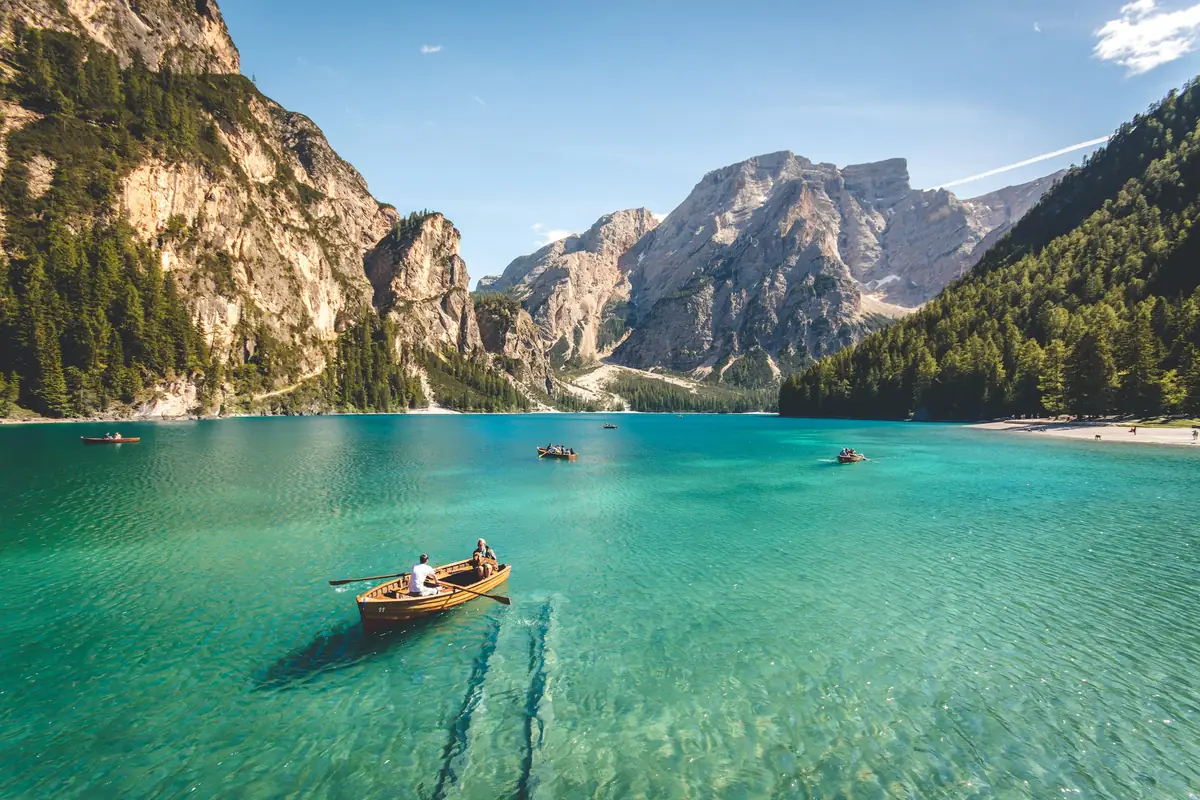 Wooden boats on the turquoise Lago di Braies below the Dolomite peaks